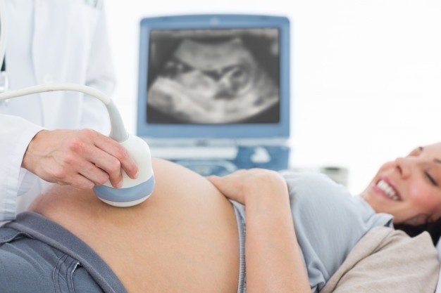 pregnant woman undergoing ultrasound 13339 18025